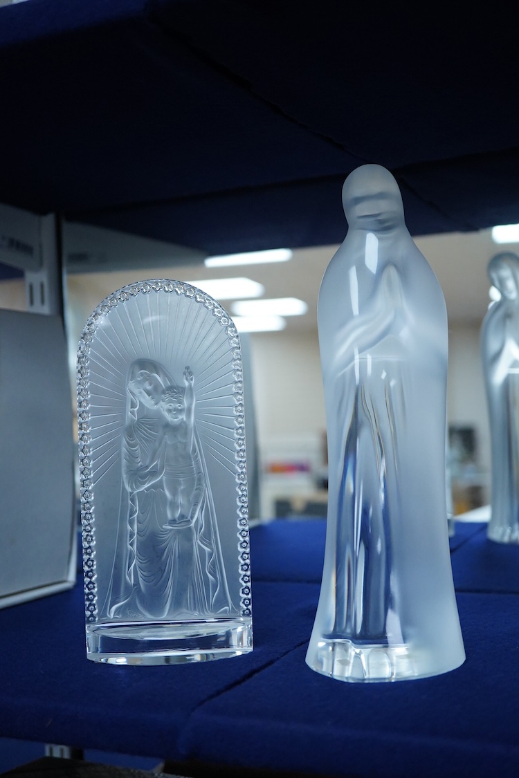 A Lalique ‘Vierge A L’Enfant Agenouille statue’ 20cm high, together with a model of ‘Virgin with hands together’, 25cm high (both boxed)